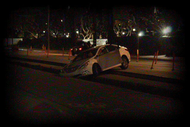 Car in trench on Hoover Street in Westminster.